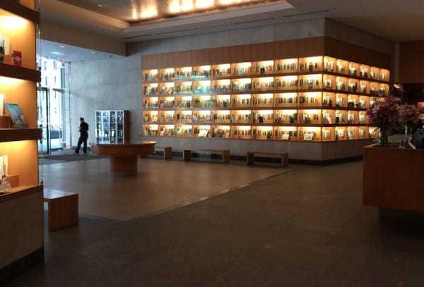 lobby of Penguin Random House, with books on lit-up shelves